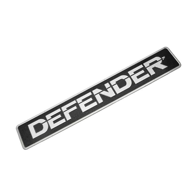 emblema aluminio defender grade frontal